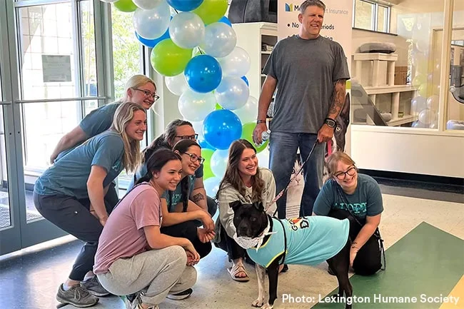 dog being adopted at an event