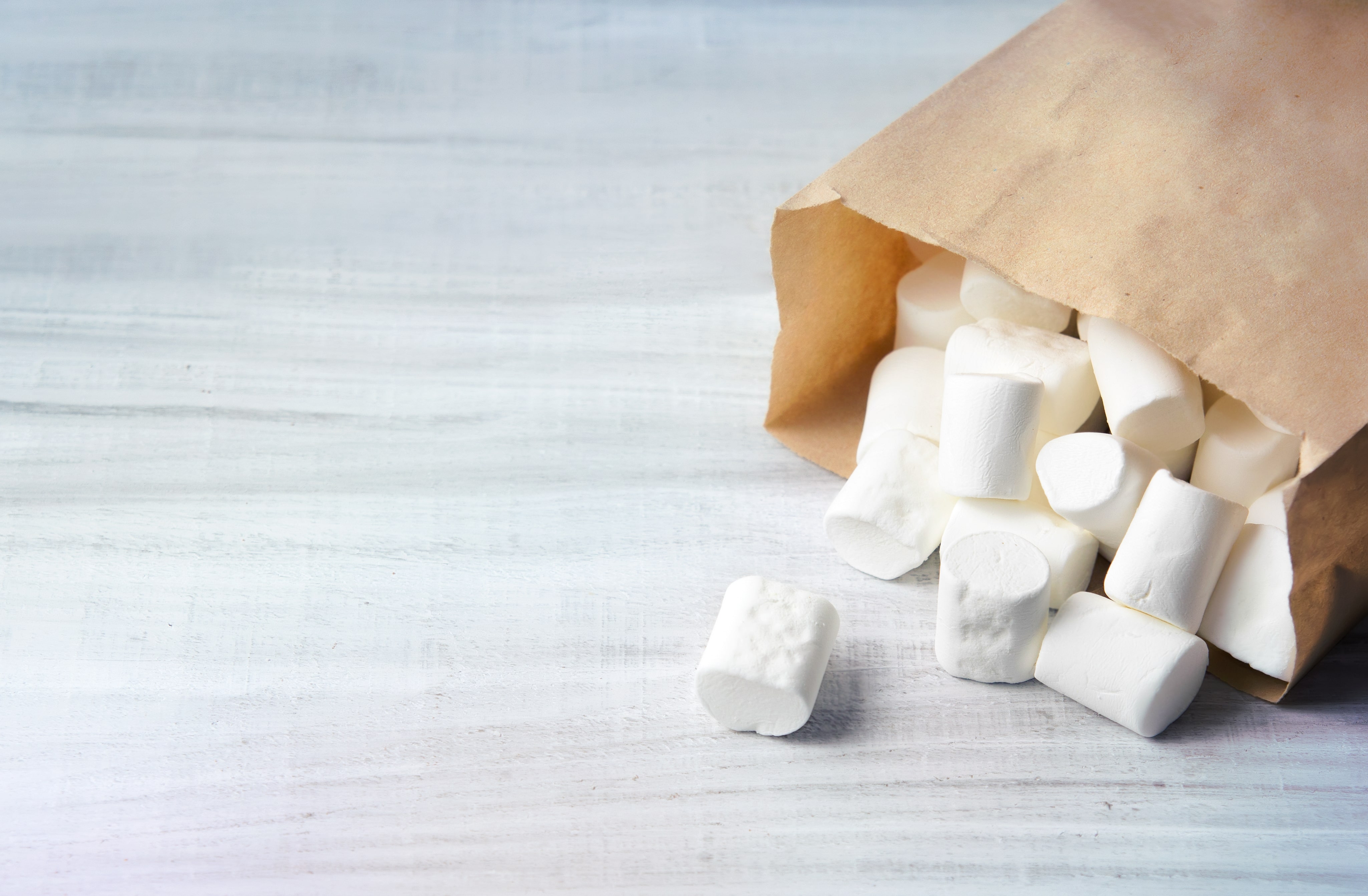 Marshmallow in paper pocket closeup.