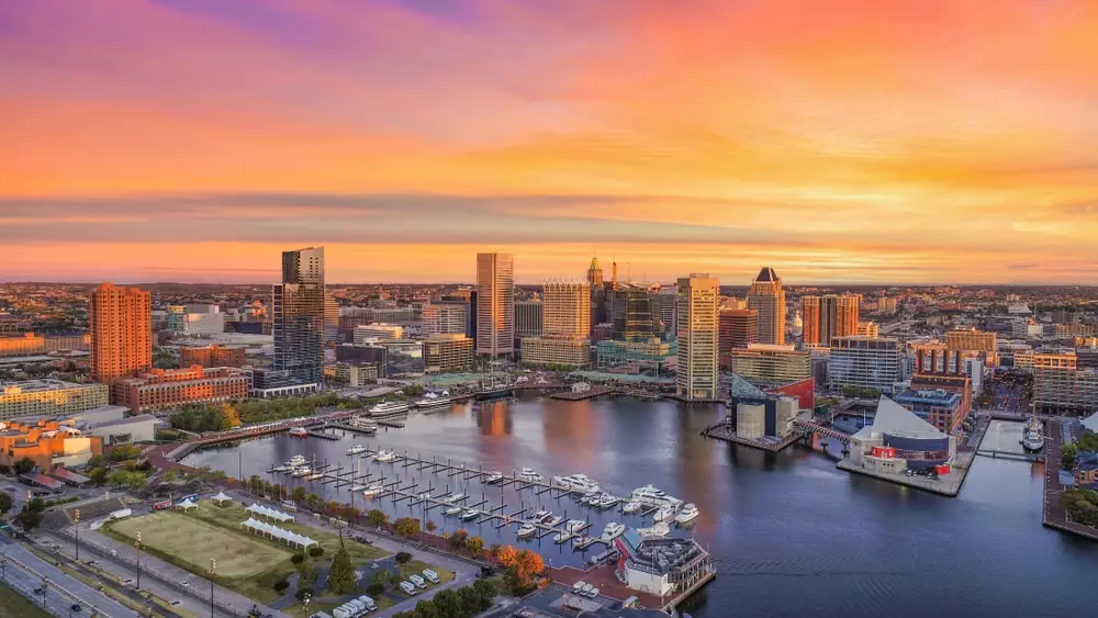 Overlooking the inner harbor and skyline of Baltimore, MD at sunset.