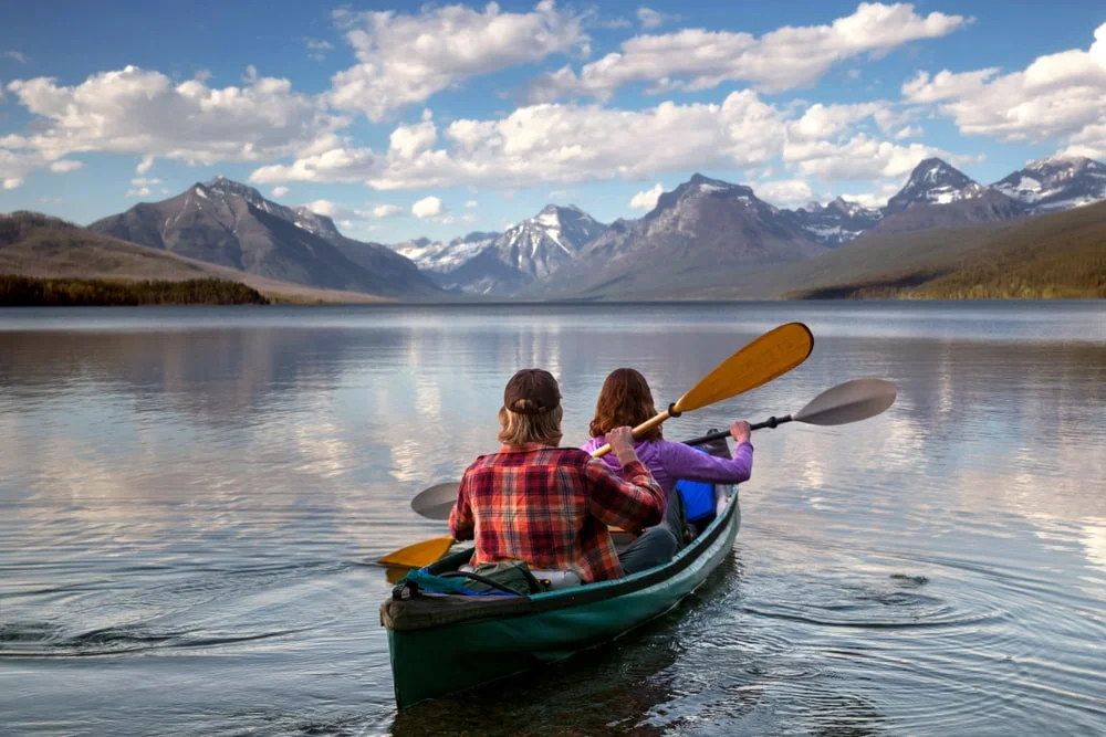 Two people go kayaking in a Montana lake
