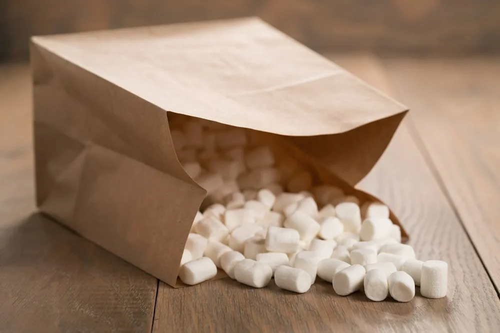 Marshmallow in paper pocket closeup.