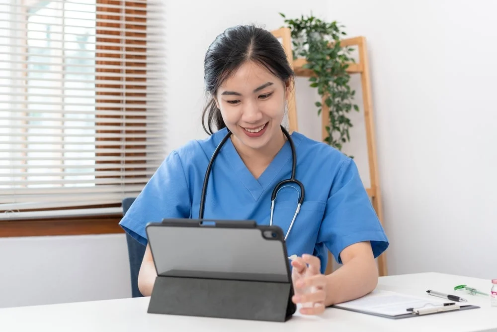 Veterinarian typing on a laptop